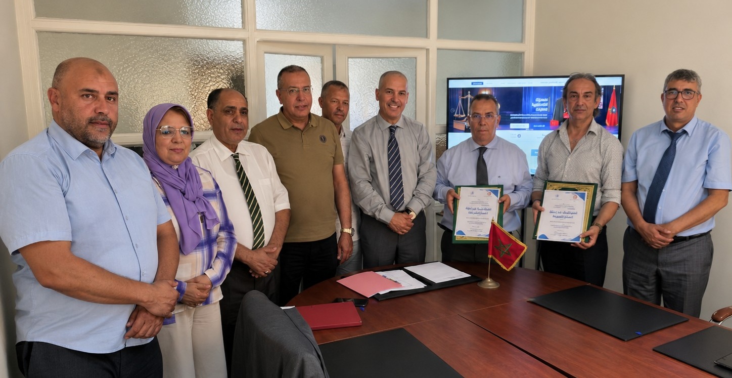 Representatives of the National Order of Judicial Officers and Sanad Idari at the partnership signing ceremony